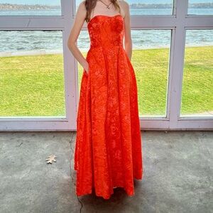 Orange brocade strapless prom dress worn once laces up in the back